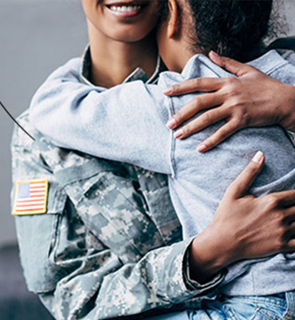 GovX military personnel hugging child