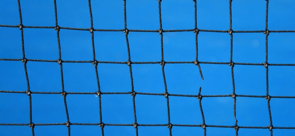 Tennis net with one broken piece