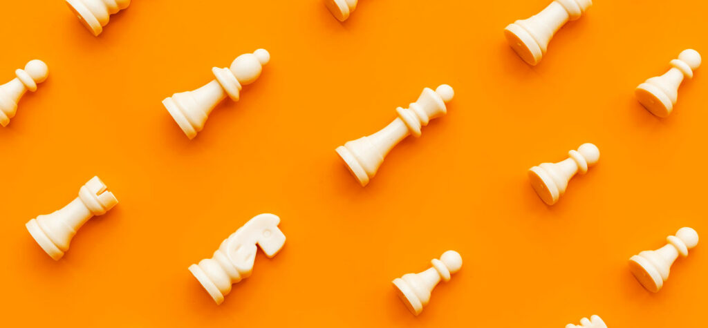 Chess pieces on an orange background