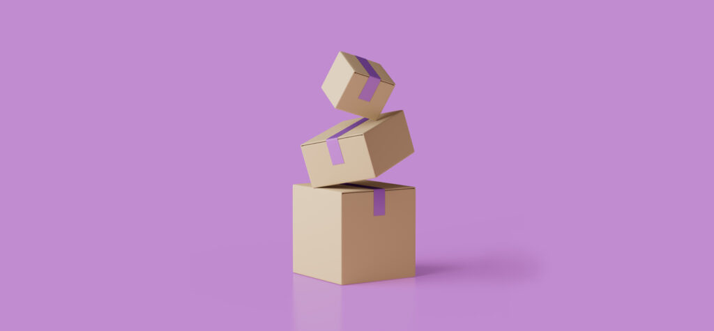 Three cardboard boxes stacked on a purple background
