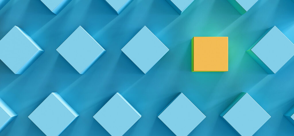 One yellow block among blue blocks