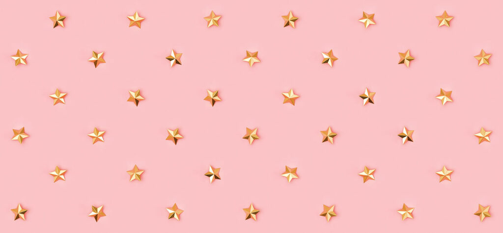 Gold star pattern on pink background