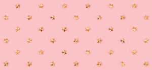 Gold star pattern on pink background